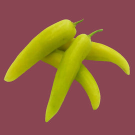 Three yellow Hungarian wax peppers against a purple background.
