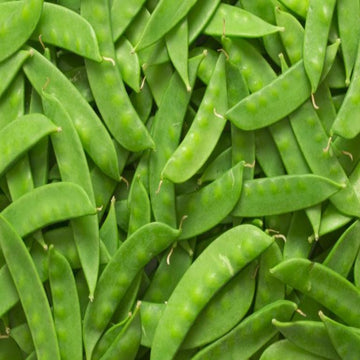 A close-up image of fresh green snow peas.